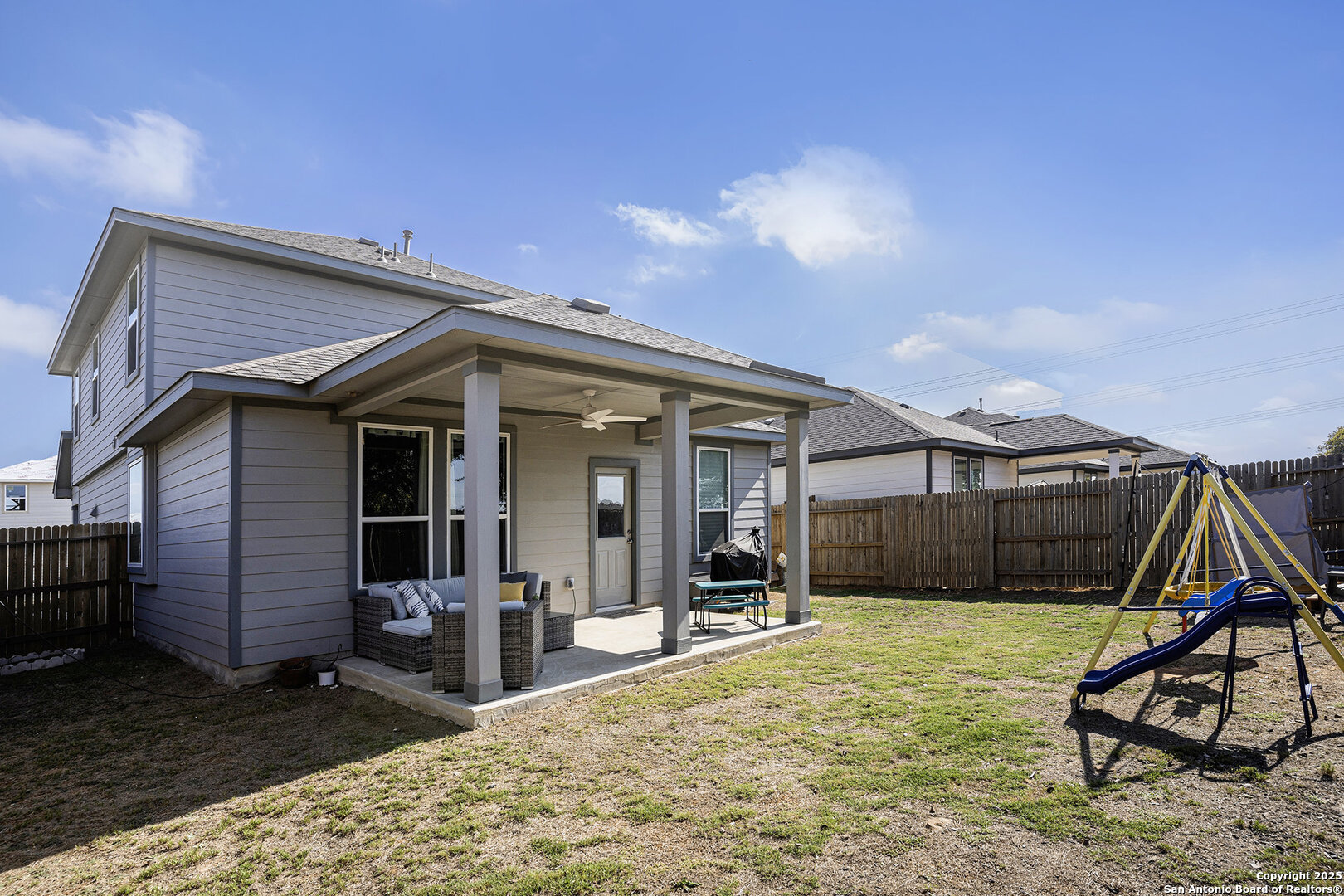 16615 Ginger Crossing Elmendorf, TX 78112 - Photo 27 of 31 a view of a house with wooden fence