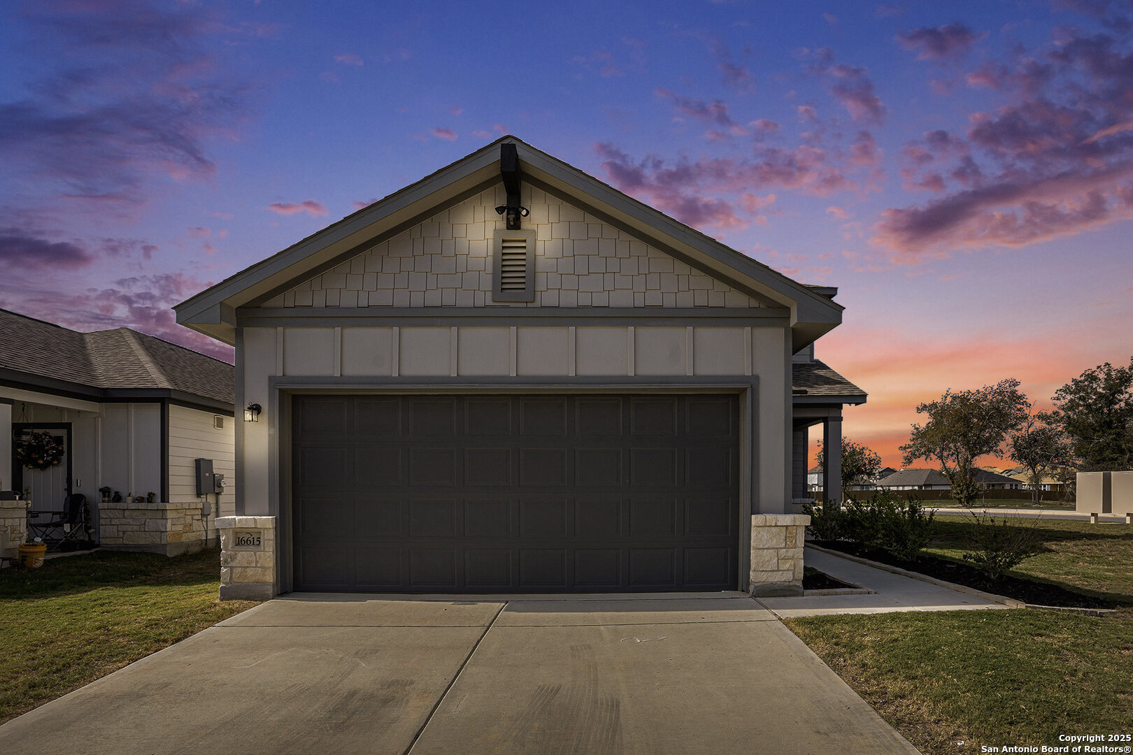 16615 Ginger Crossing Elmendorf, TX 78112 - Photo 29 of 31 a front view of a house with a yard