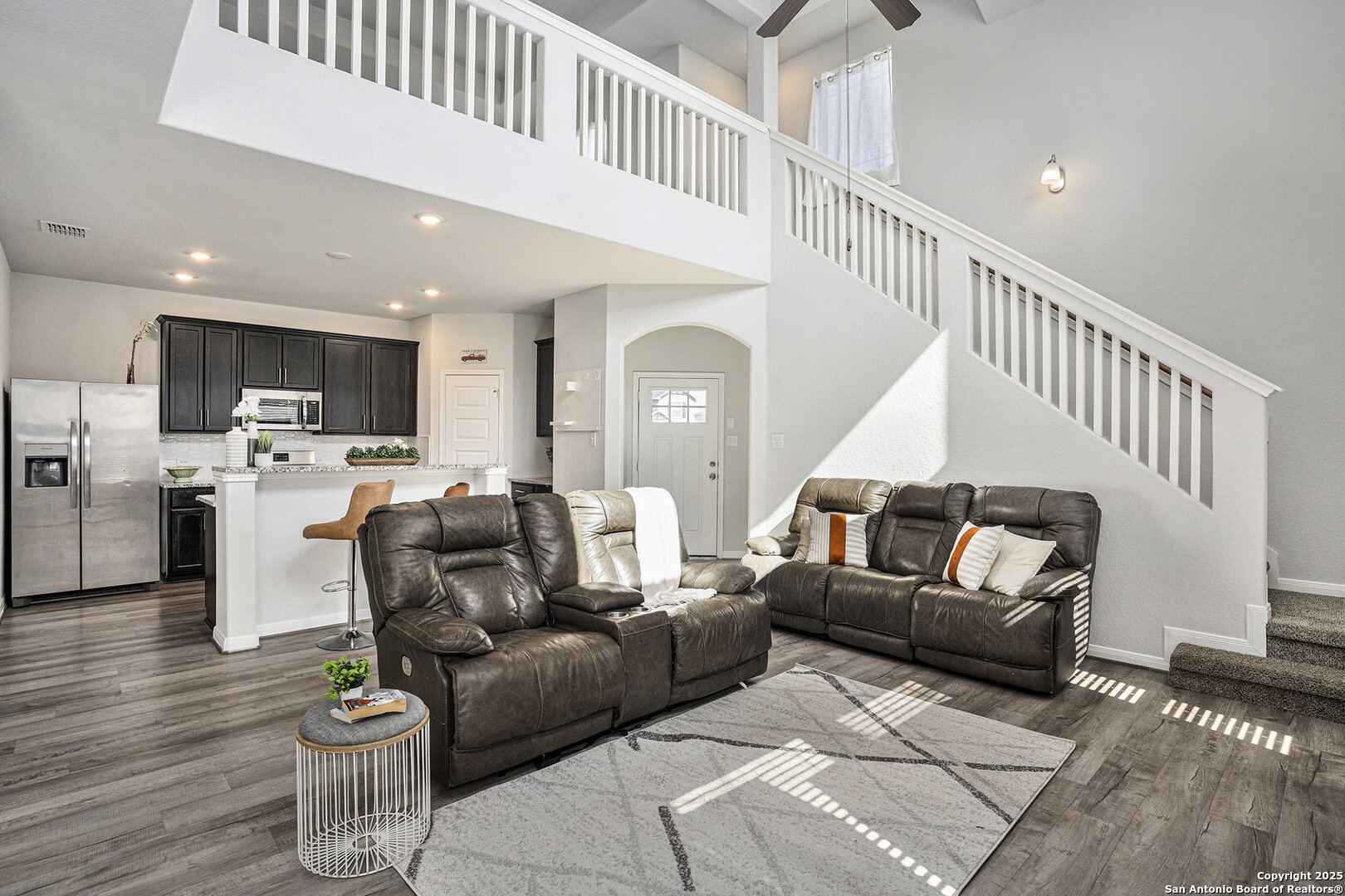 16615 Ginger Crossing Elmendorf, TX 78112 - Photo 3 of 31 a living room with furniture and kitchen view