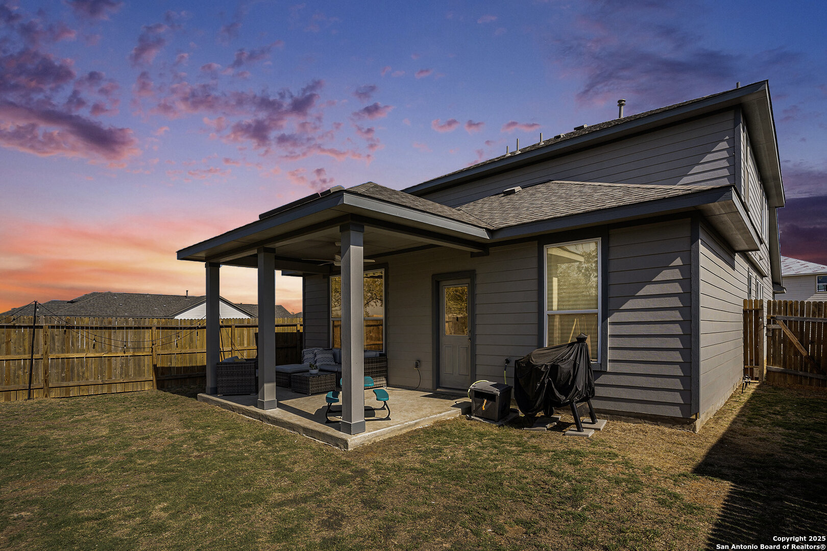 16615 Ginger Crossing Elmendorf, TX 78112 - Photo 31 of 31 a backyard of a house with table and chairs