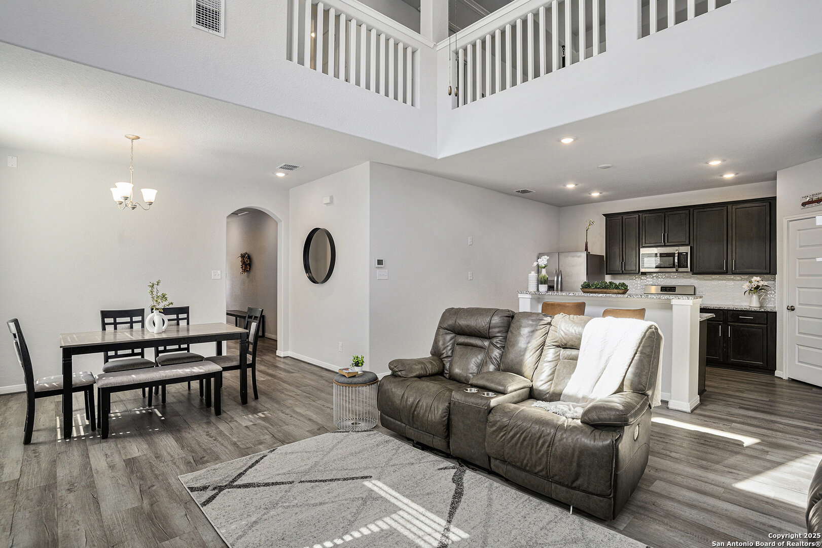 16615 Ginger Crossing Elmendorf, TX 78112 - Photo 4 of 31 a living room with furniture and kitchen view