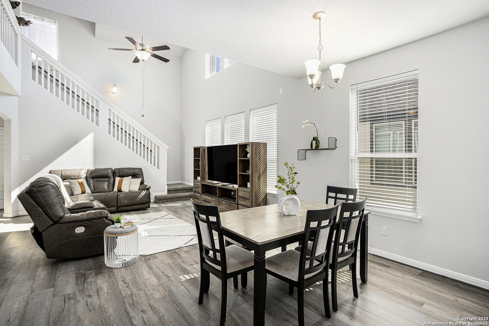 16615 Ginger Crossing Elmendorf, TX 78112 - Photo 7 of 31 a living room with furniture a flat screen tv and a window