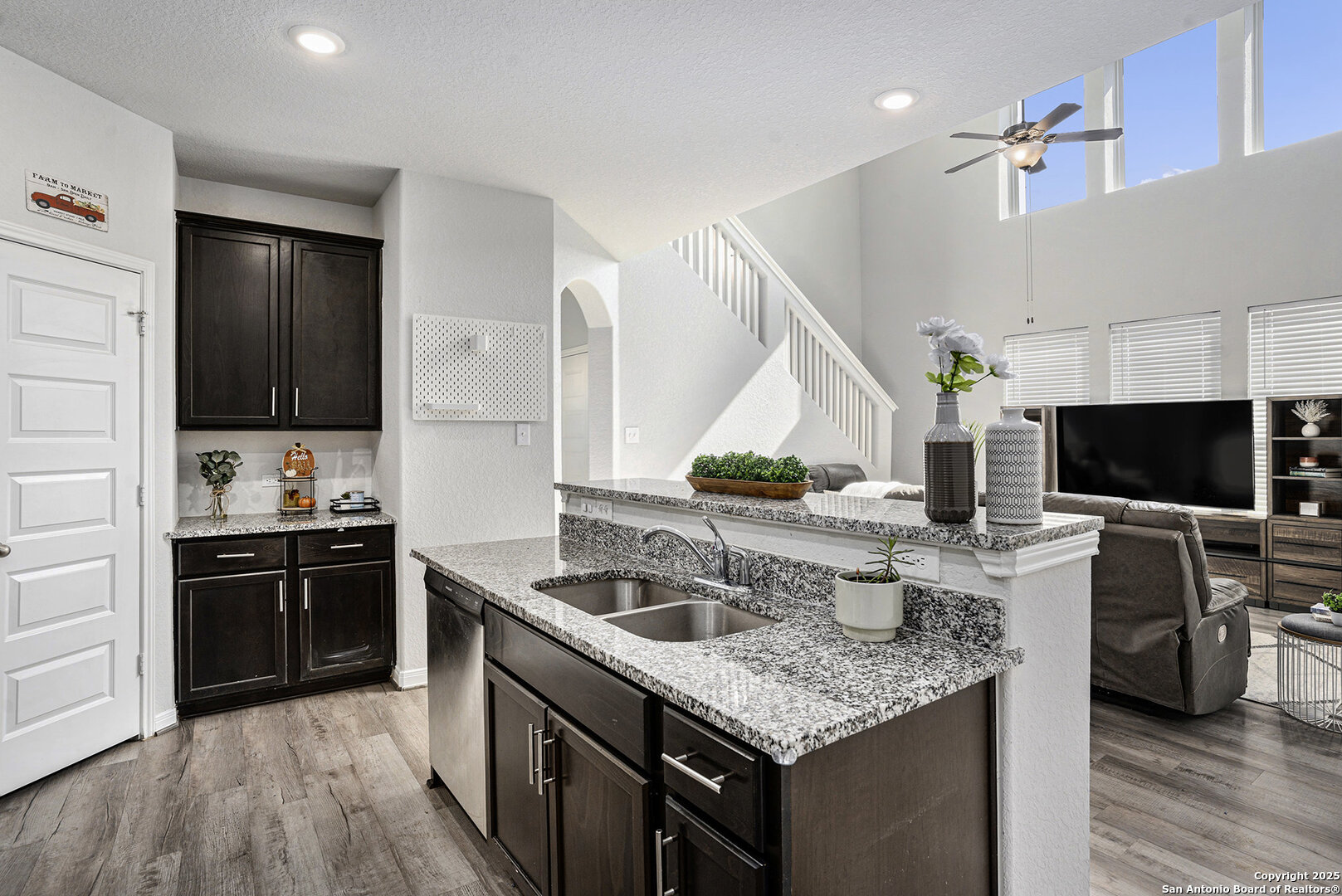16615 Ginger Crossing Elmendorf, TX 78112 - Photo 9 of 31 a kitchen with a stove and a sink