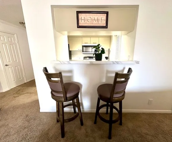 a view of a dining room with furniture