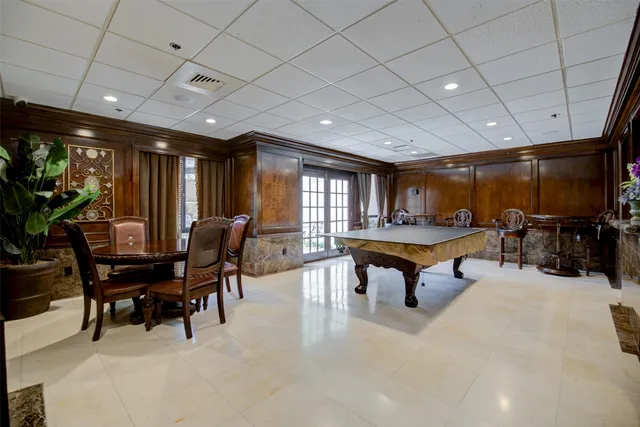 a living room with furniture a projector and a wooden floor