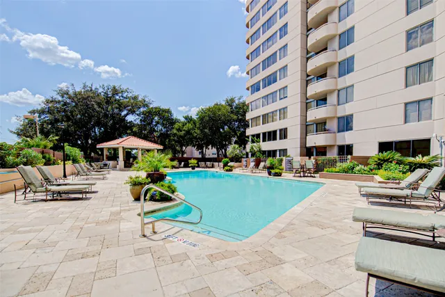 a view of a building with garden and entertaining space