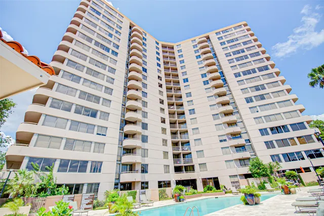a view of a living room and kitchen