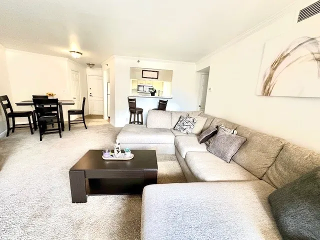 a living room with furniture and a table