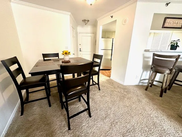 a view of a dining room with furniture