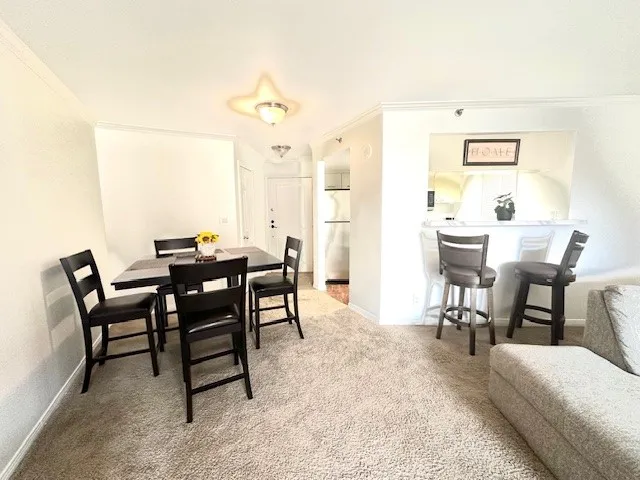 a view of a dining room with furniture