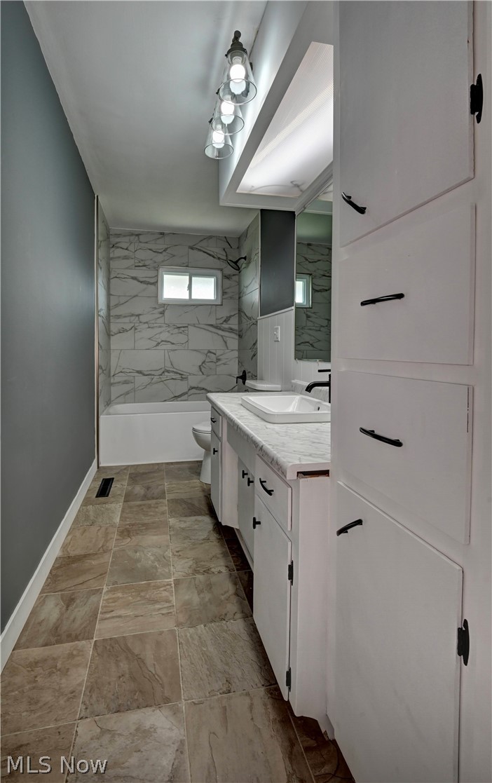 3265 York View Road Southwest New Philadelphia, OH 44663 - Photo 14 of 45 Bathroom featuring vanity and bathing tub / shower combination