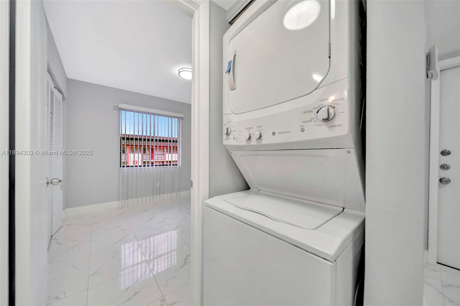 871 Northeast 207th Terrace, Unit 4202 Miami, FL 33179 - Photo 13 of 27 a view of washer and dryer