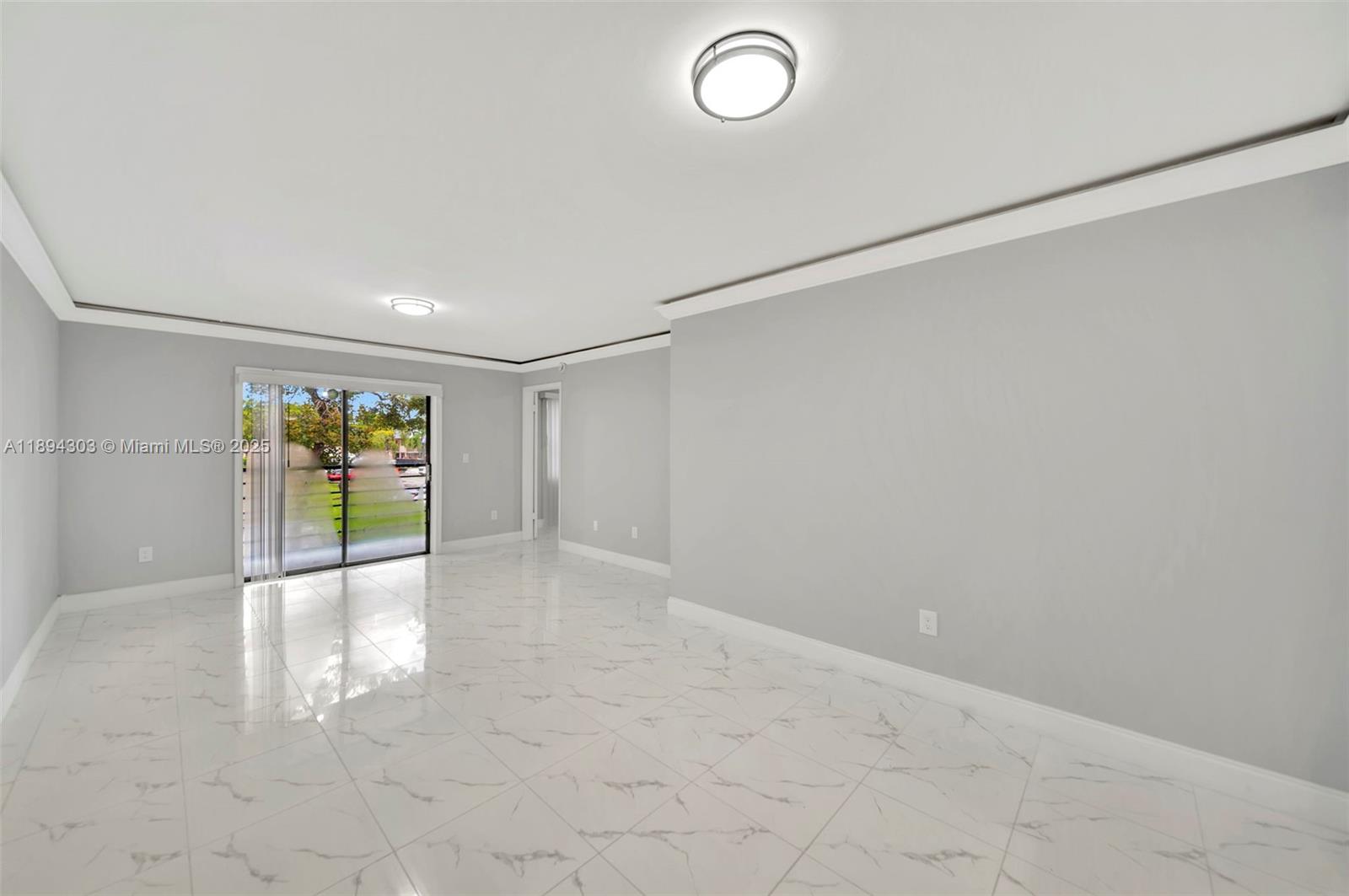 871 Northeast 207th Terrace, Unit 4202 Miami, FL 33179 - Photo 19 of 27 a view of an empty room with a window