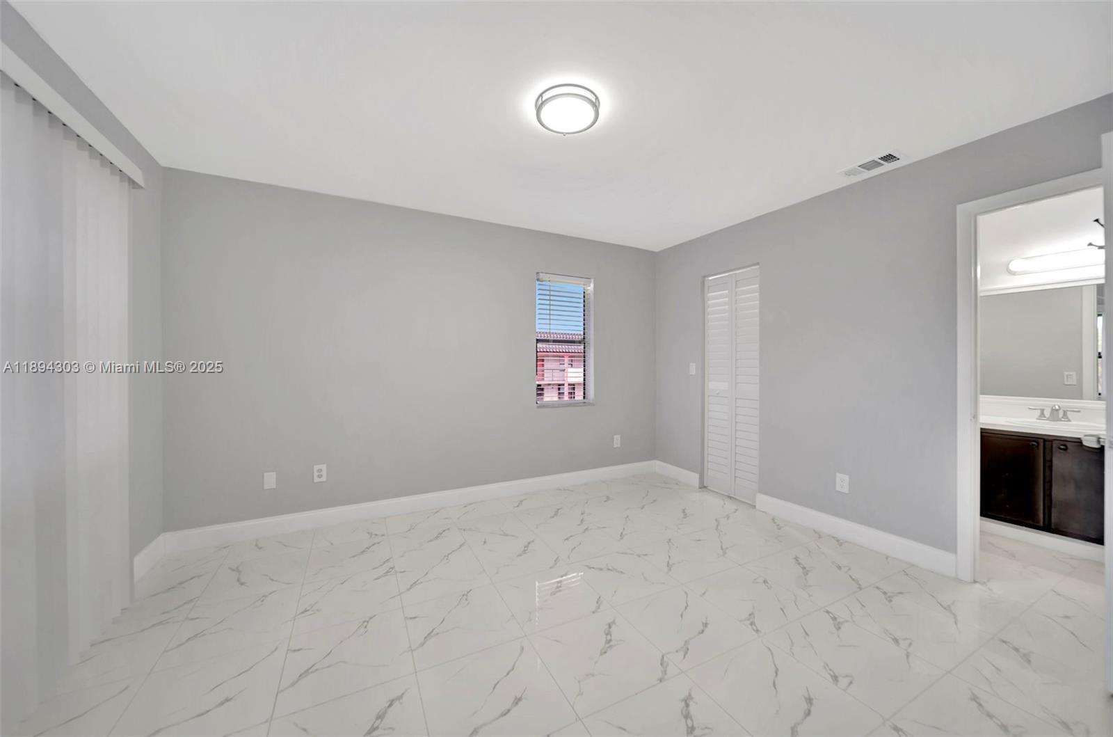 871 Northeast 207th Terrace, Unit 4202 Miami, FL 33179 - Photo 20 of 27 a view of empty room with a fireplace