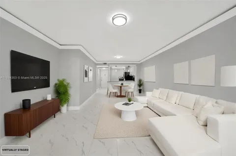 a view of a livingroom with furniture and a flat screen tv