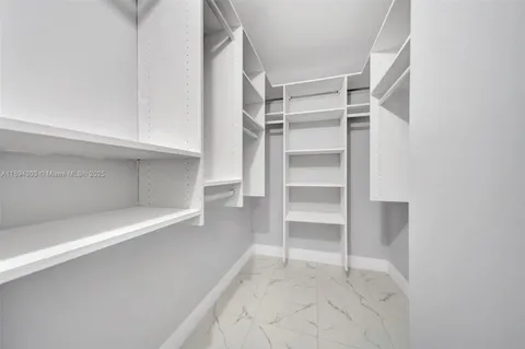 a view of an empty walk in closet
