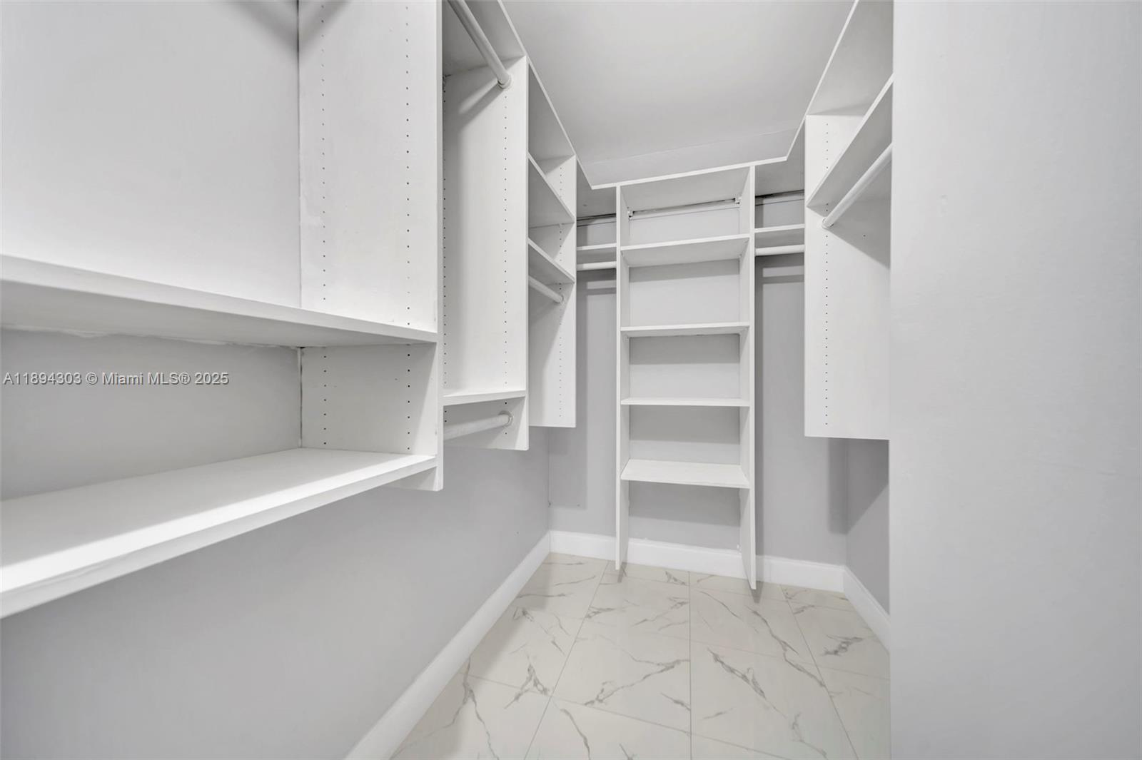 871 Northeast 207th Terrace, Unit 4202 Miami, FL 33179 - Photo 7 of 27 a view of an empty walk in closet
