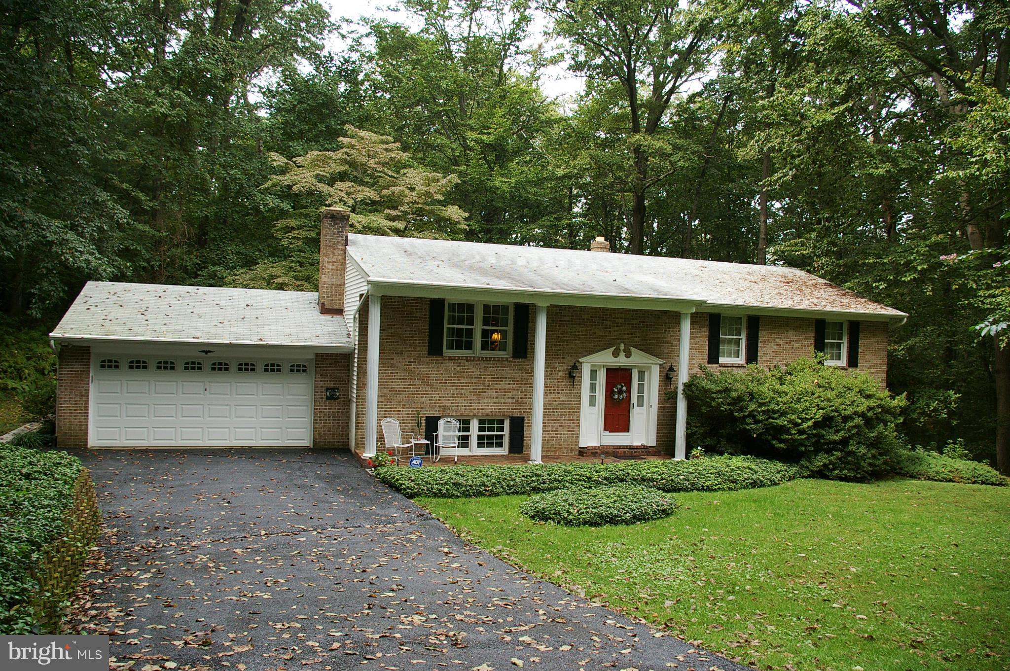 2012 Fallsgrove Way Fallston, MD 21047 - Photo 1 of 12 a front view of a house with a garden and yard