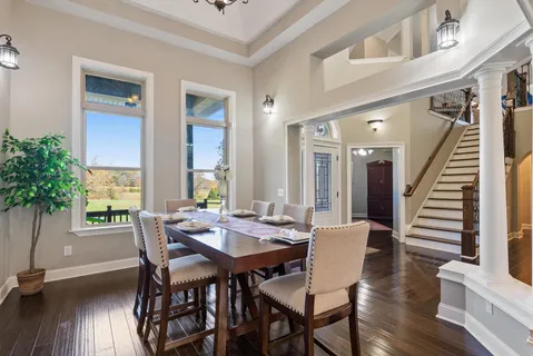 a kitchen with stainless steel appliances granite countertop a sink a stove and a refrigerator