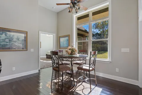 a view of a workspace with wooden floor and a workspace