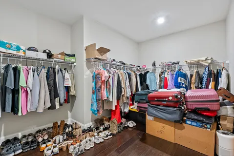 a en suite bathroom with a granite countertop sink and a mirror
