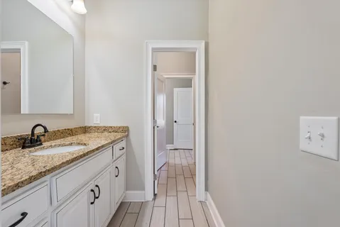 a view of a patio with table and chairs a barbeque with wooden floor and fence