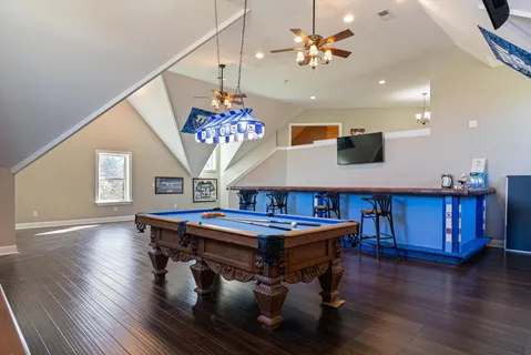 a view of a field with an trees in the background