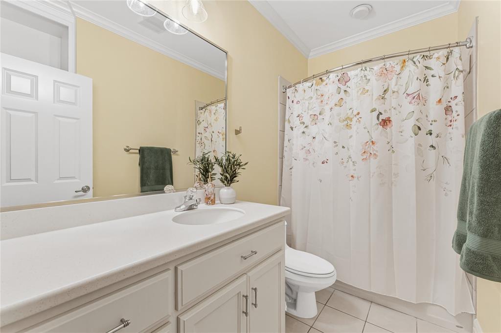 3201 Edward Drive Waco, TX 76708 - Photo 28 of 40 a bathroom with a sink a toilet and shower curtain