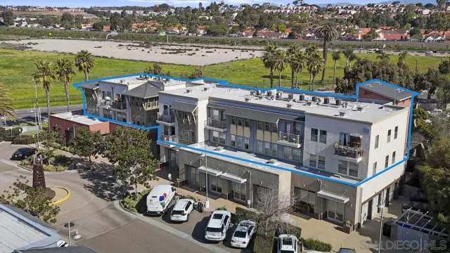 a view of a fountain in front of a house