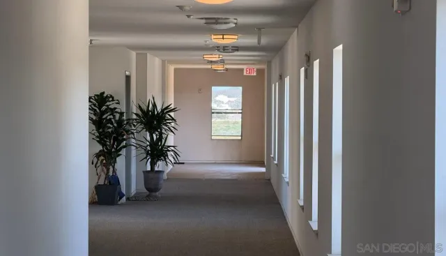 a view of a swimming pool with a lounge chair