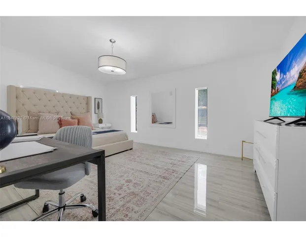 a view of a livingroom with furniture and furniture