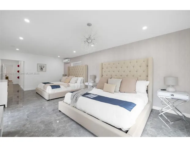 a living room with furniture and a large mirror