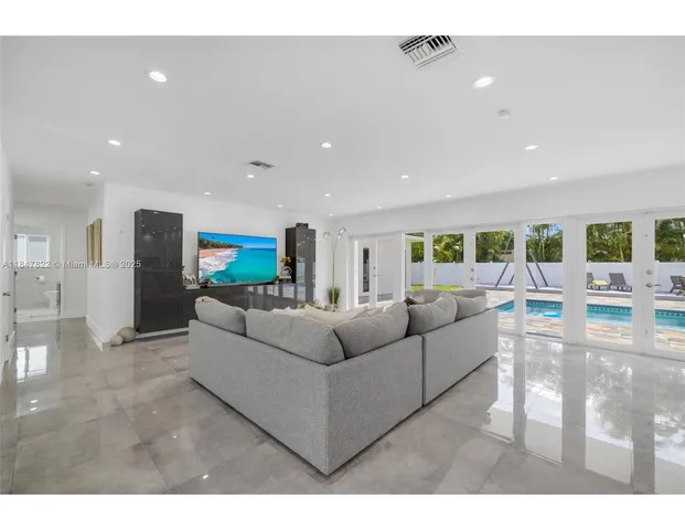 a living room with furniture and a table