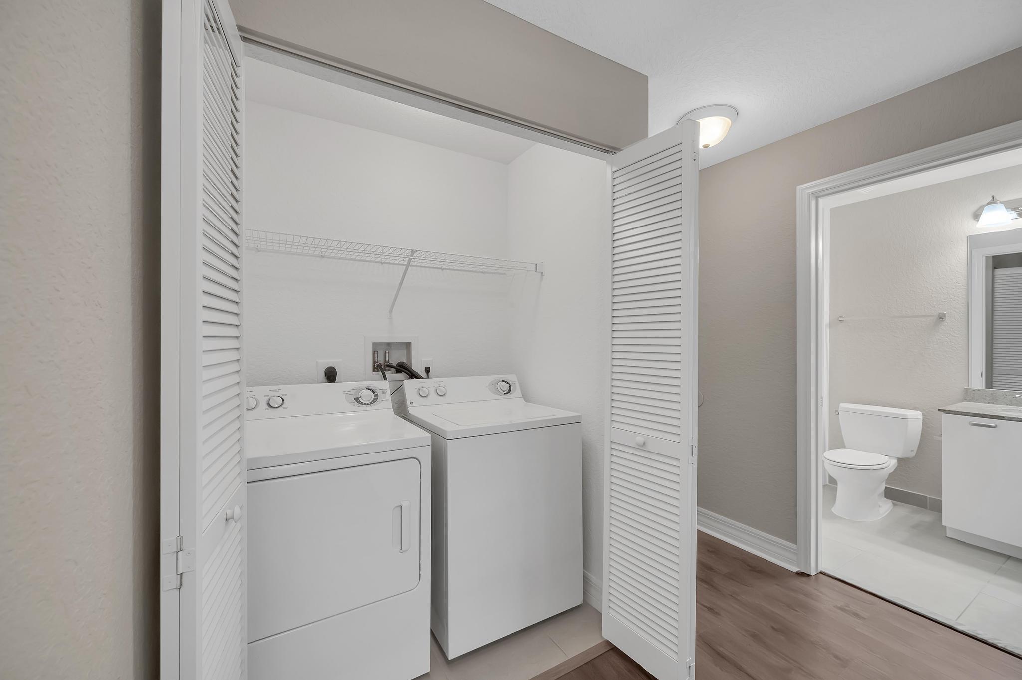55 Southeast Palermo, Unit 106 Stuart, FL 34994 - Photo 27 of 39 a view of utility room with washer and dryer