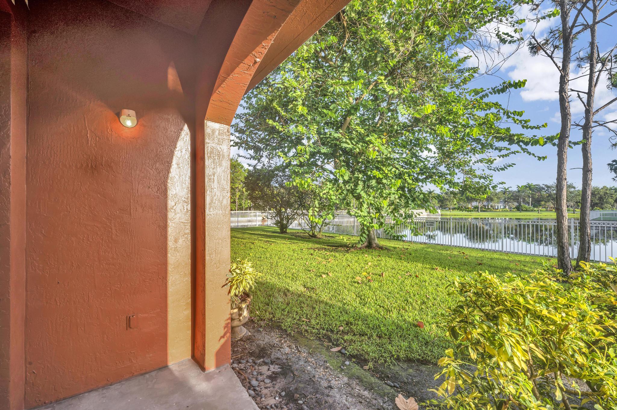 55 Southeast Palermo, Unit 106 Stuart, FL 34994 - Photo 33 of 39 a view of swimming pool from a yard