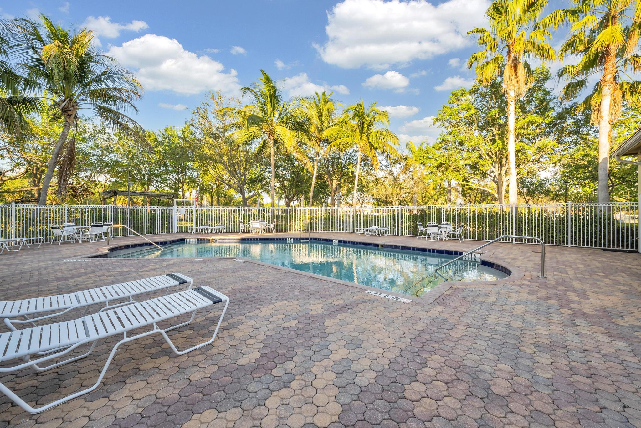 55 Southeast Palermo, Unit 106 Stuart, FL 34994 - Photo 36 of 39 a view of yard with swimming pool