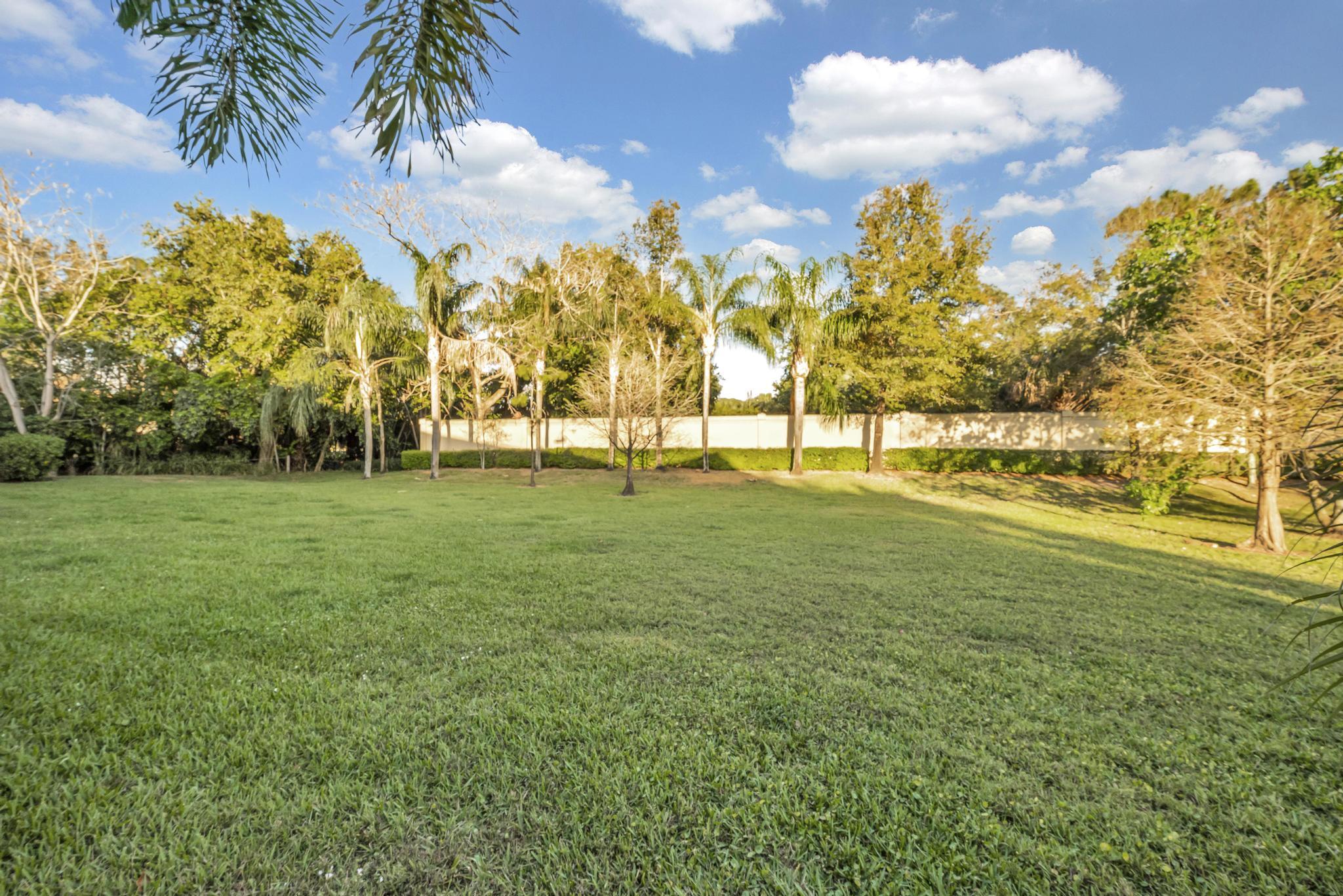 55 Southeast Palermo, Unit 106 Stuart, FL 34994 - Photo 39 of 39 a view of yard with an trees