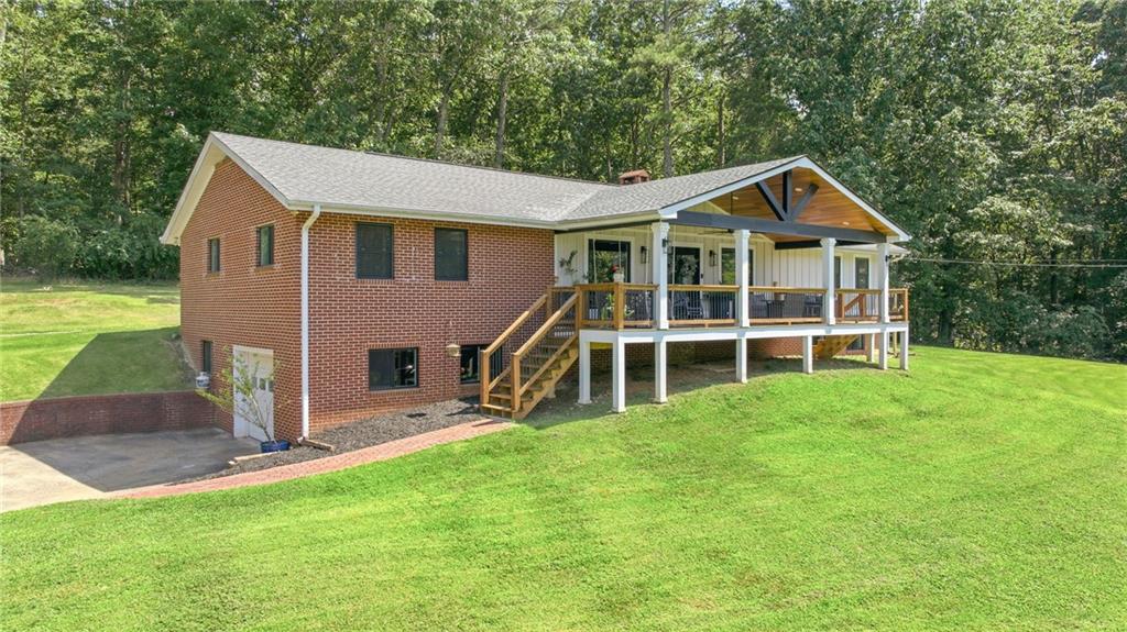 6470 Samoa Way Flowery Branch, GA 30542 - Photo 61 of 61 a view of a house with a yard and sitting area