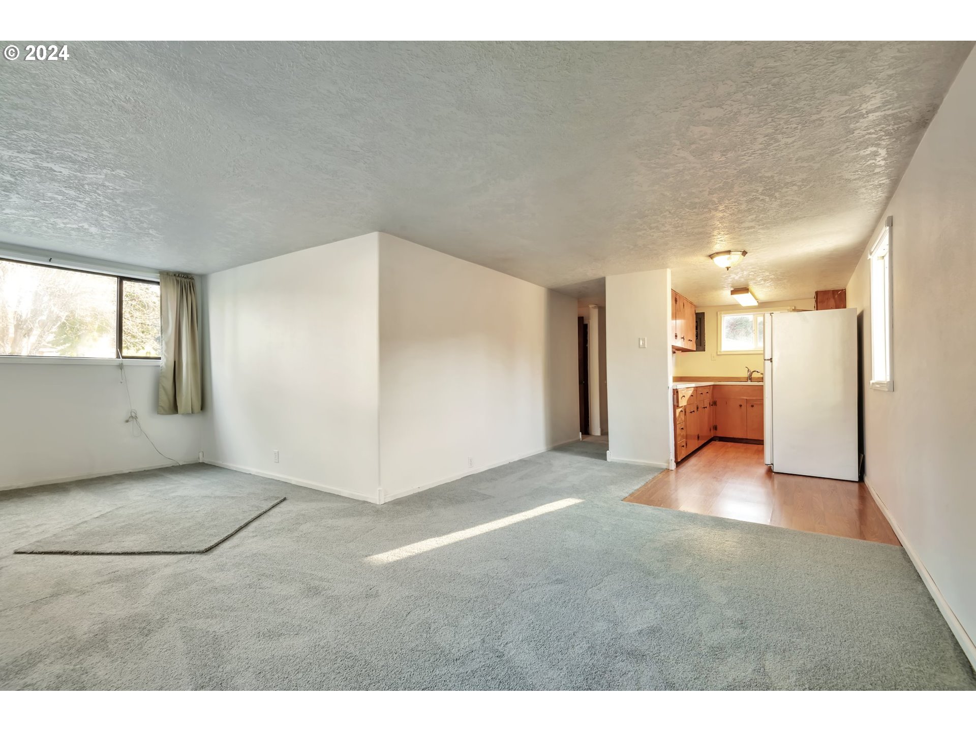 457 Southwest Forest Road Estacada, OR 97023 - Photo 5 of 31 a view of a big room with windows and chandelier