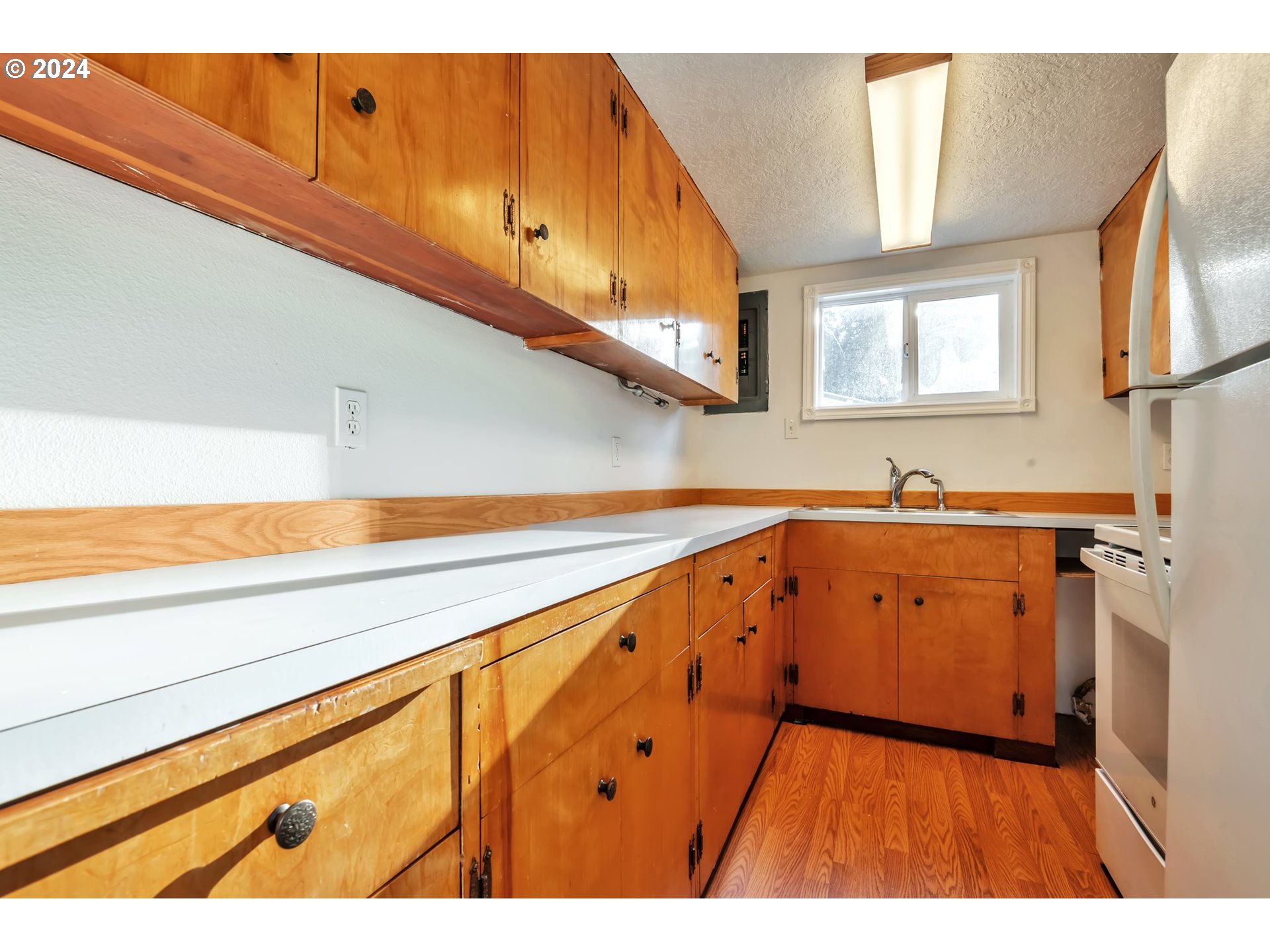 457 Southwest Forest Road Estacada, OR 97023 - Photo 8 of 31 a kitchen with a sink and cabinets