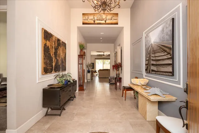 a lobby with furniture and two windows