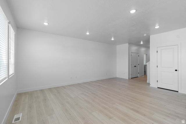 2770 West Aurora Avenue Mapleton, UT 84664 - Photo 4 of 16 Unfurnished room with light wood finished floors and recessed lighting