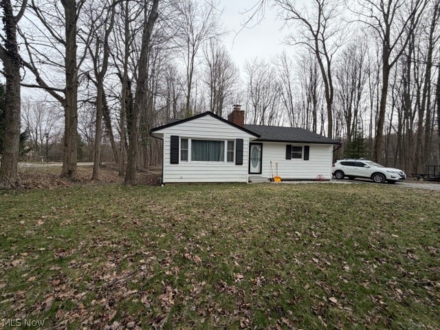 35180 Solon Road Solon, OH 44139 - Photo 1 of 33 Ranch-style home featuring a chimney and a front yard