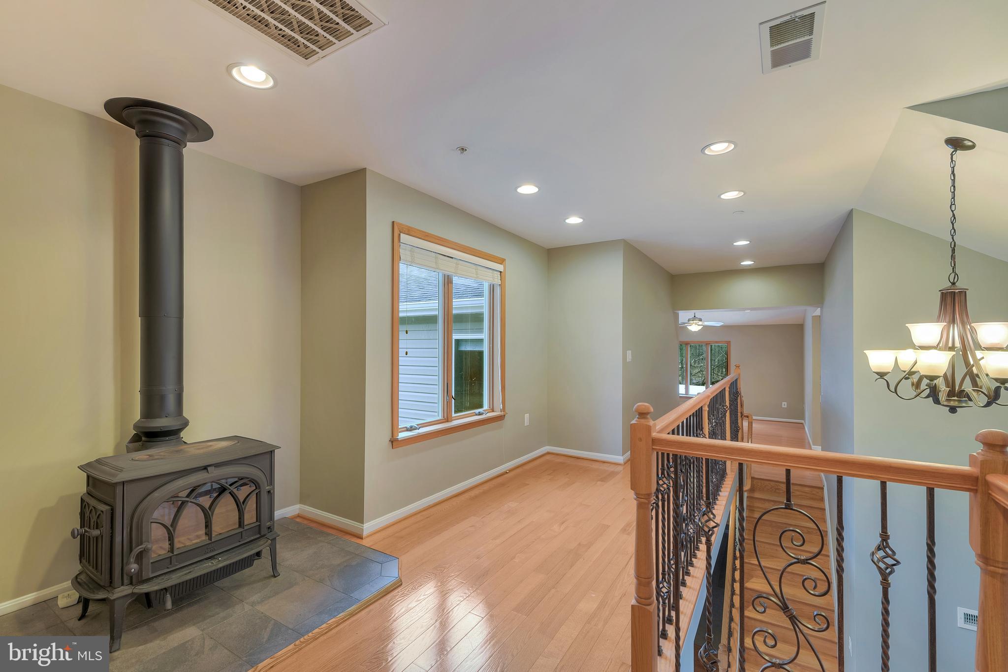 7715 Paradise Beach Road Pasadena, MD 21122 - Photo 41 of 66 UPPER HALL WITH WOOD STOVE