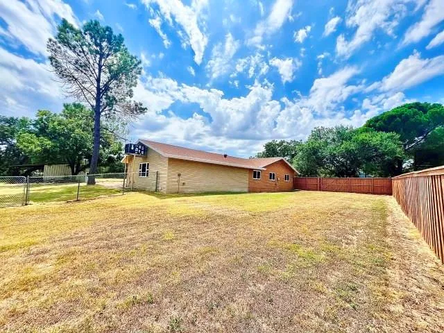 a bathroom with a sink and a yard