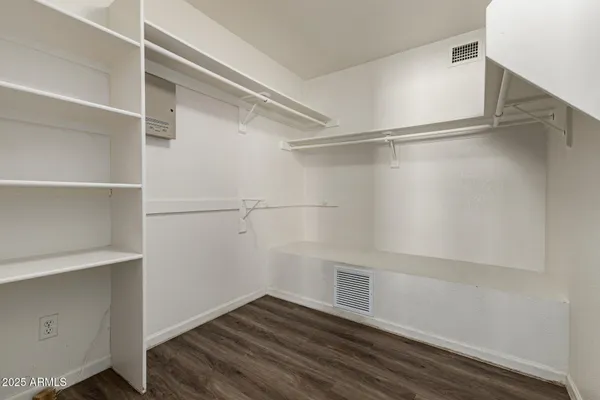 a view of an empty walk in closet