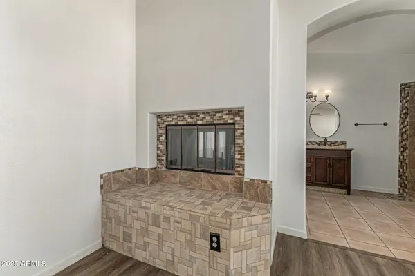 a living room with a sink and a mirror