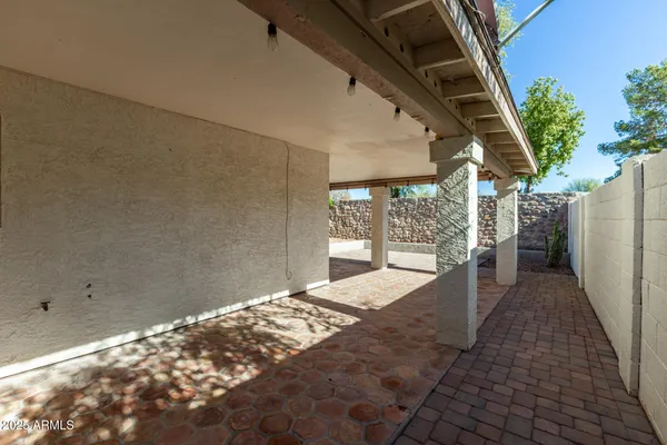 a view of balcony with wooden floor and plants
