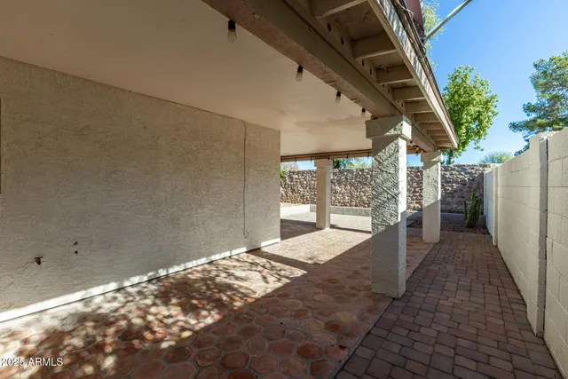 a view of balcony with wooden floor and plants