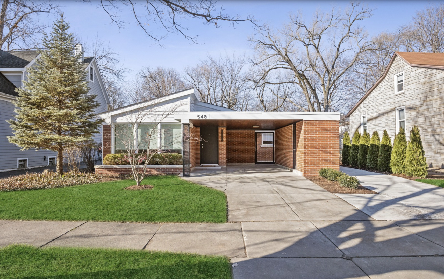 548 Exmoor Road Kenilworth, IL 60043 - Photo 1 of 19 a front view of a house with garden and patio